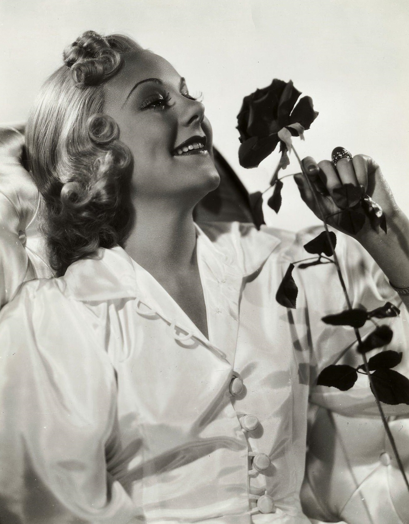 Sonja Henie Smelling A Rose In A Promotional Photo For &Amp;Quot;Hot And Happy.&Amp;Quot;