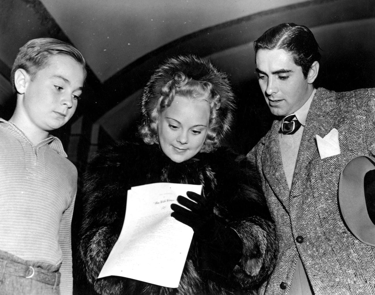 Sonja Henie With Film Actor Tyrone Power, Stopping To Give An Autograph To A Young Fan, Circa 1935.