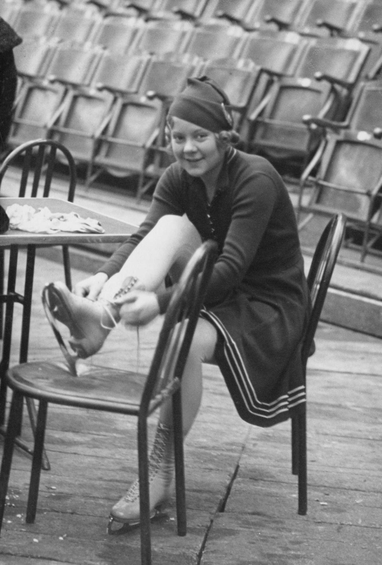 Sonja Henie Tying The Laces On Her Ice Skates, Circa 1935.