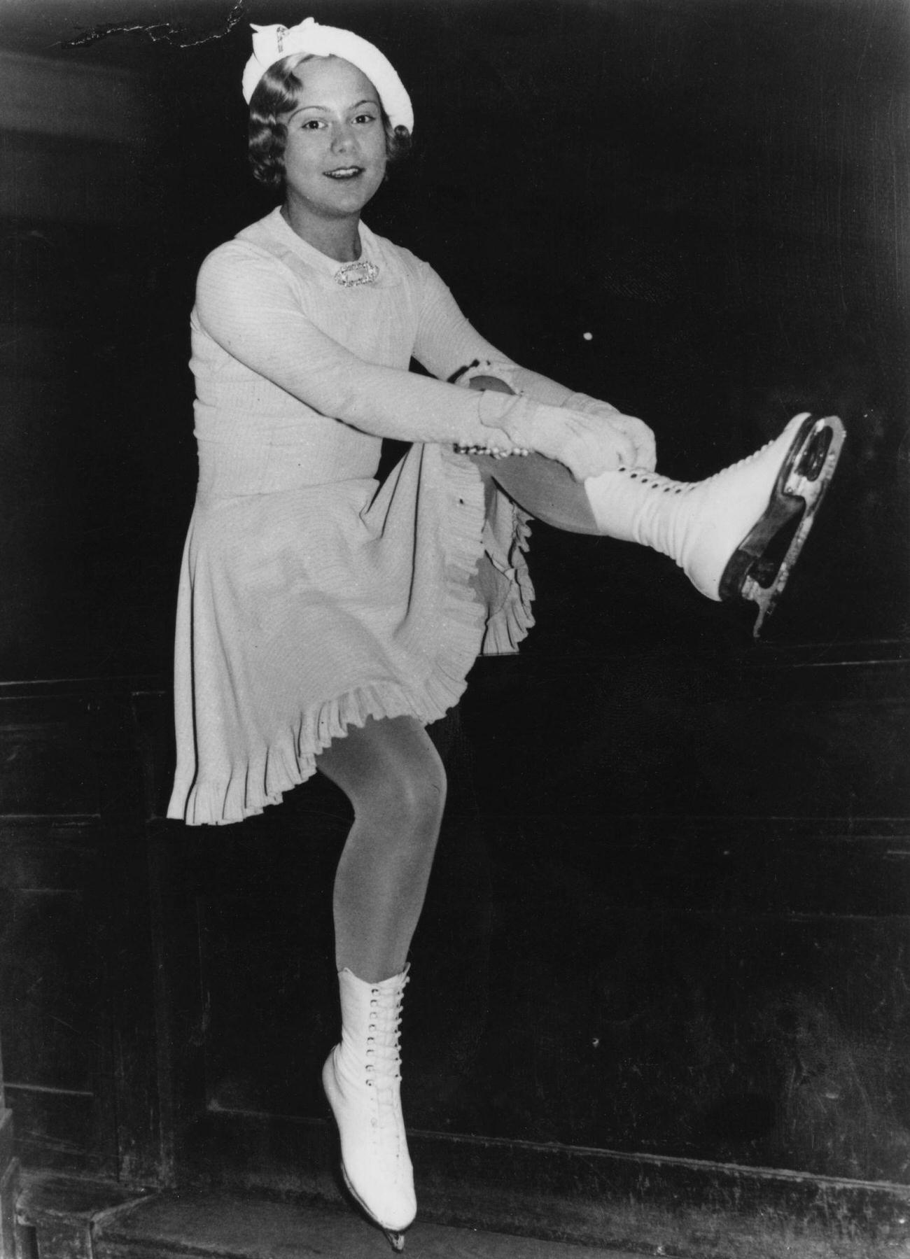 Sonja Henie Putting On Her Ice Skates, October 1935.