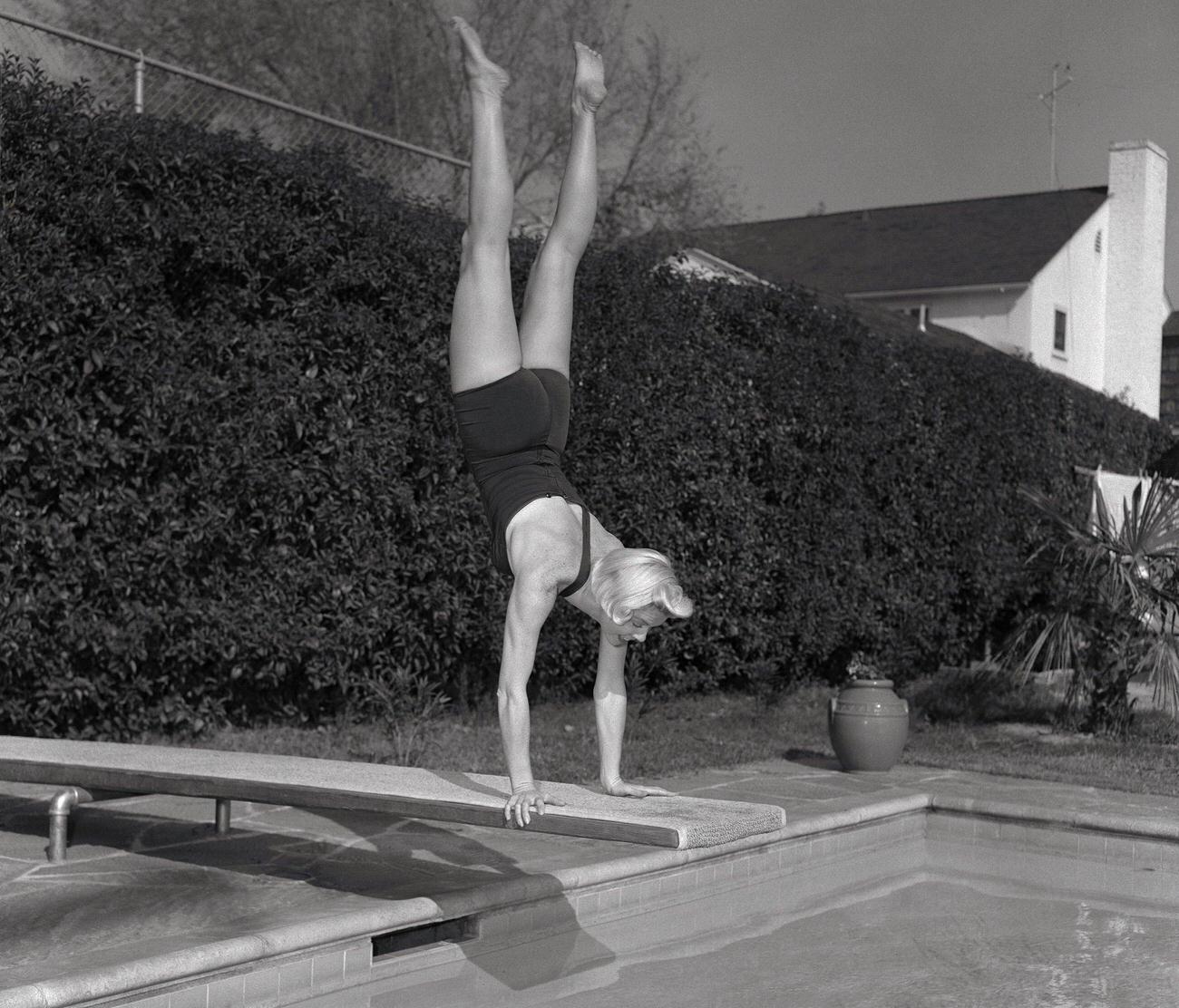 Doris Day Diving Into A Pool, In Contrast To Snowy Weather Elsewhere, During &Amp;Quot;Storm Warning&Amp;Quot;.