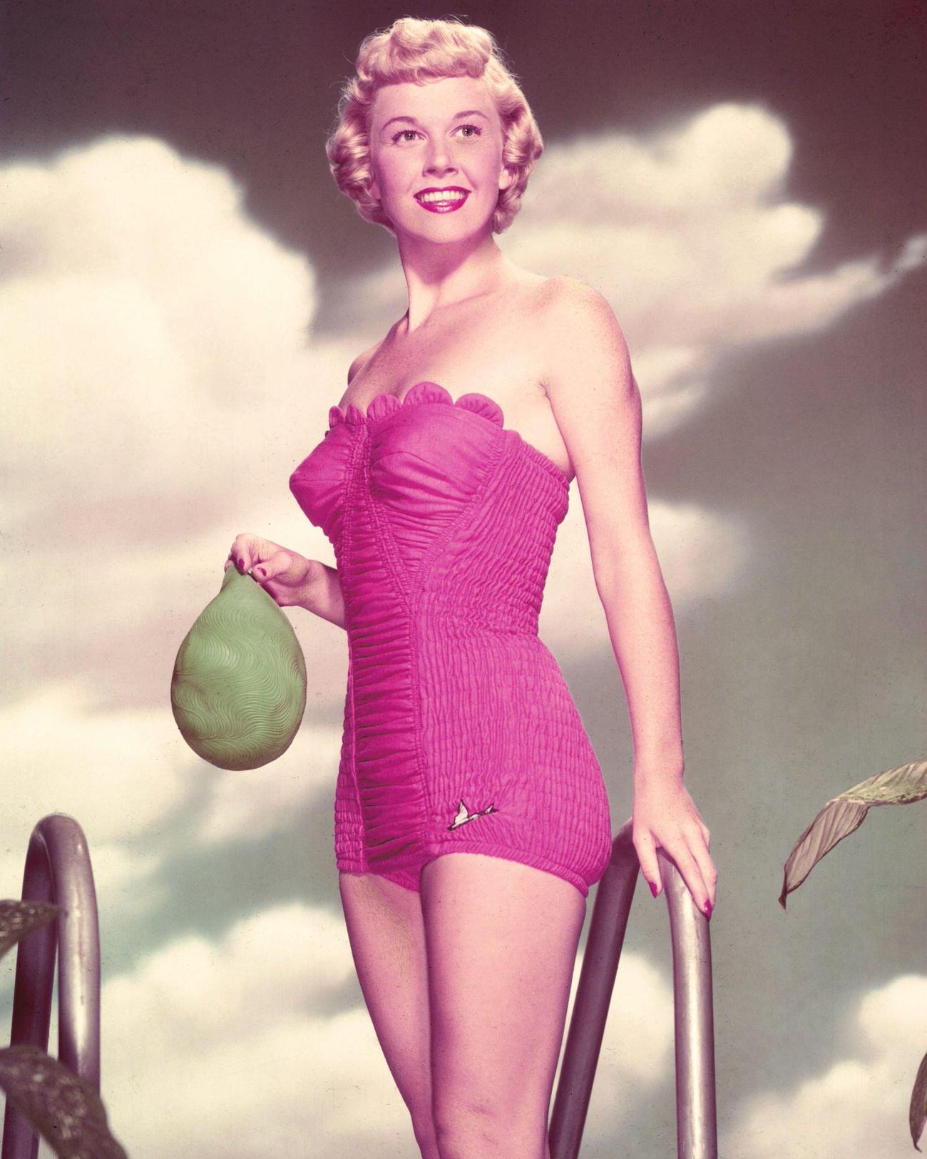Doris Day In A Pink Swimsuit And Holding A Green Swimming Cap, Circa 1955.