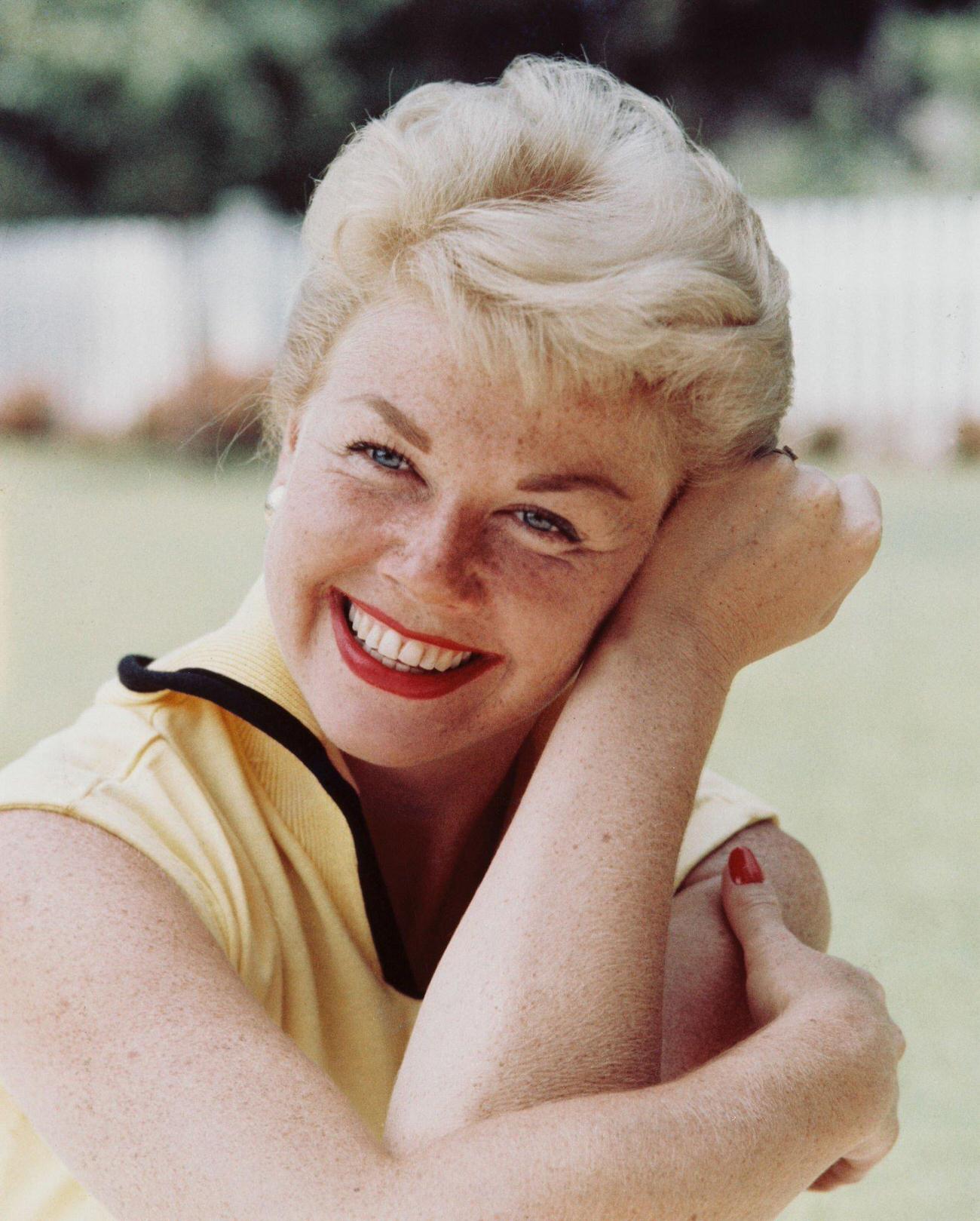 Doris Day Smiling And Resting Her Head Against Her Arm, Circa 1960.