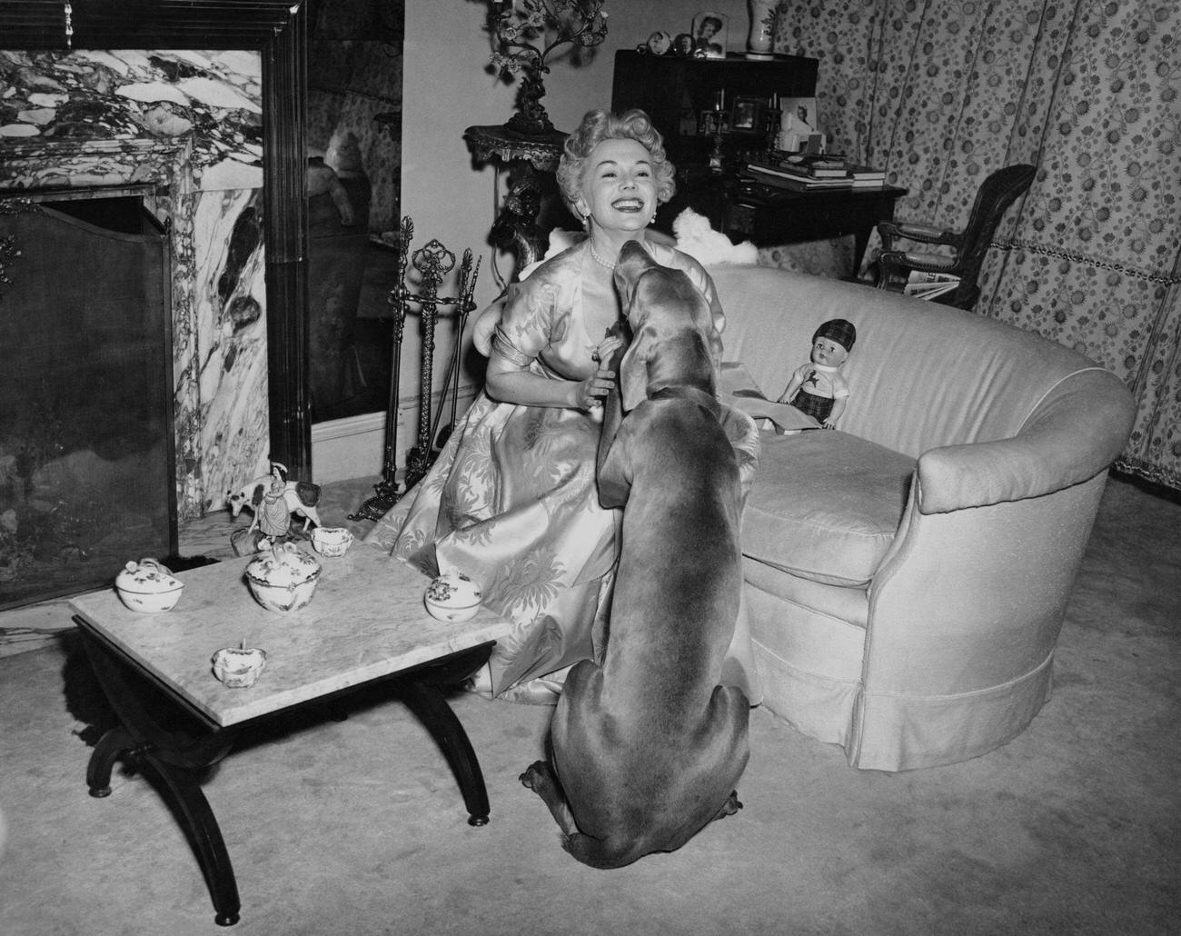 Eva Gabor With An Affectionate Dog, Circa 1955.
