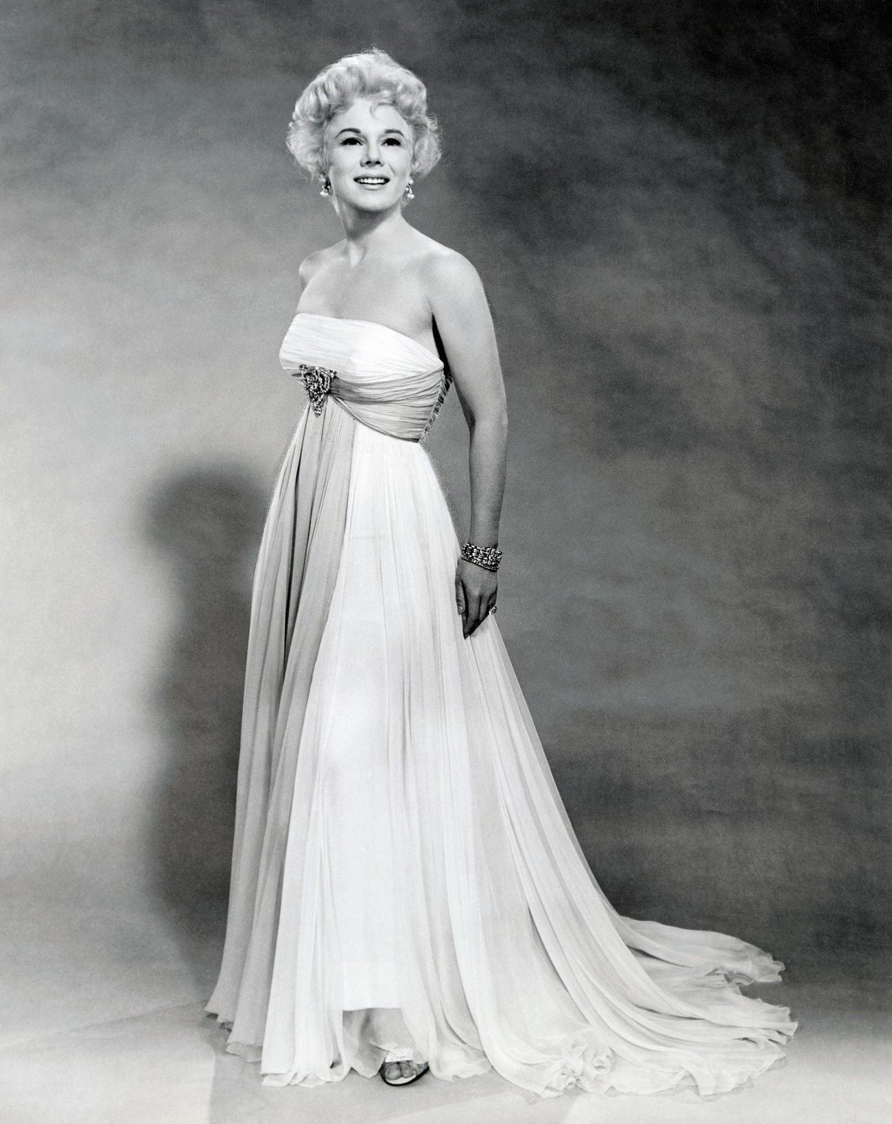 Eva Gabor As A Fashion Correspondent In Mgm'S Don'T Go Near The Water.