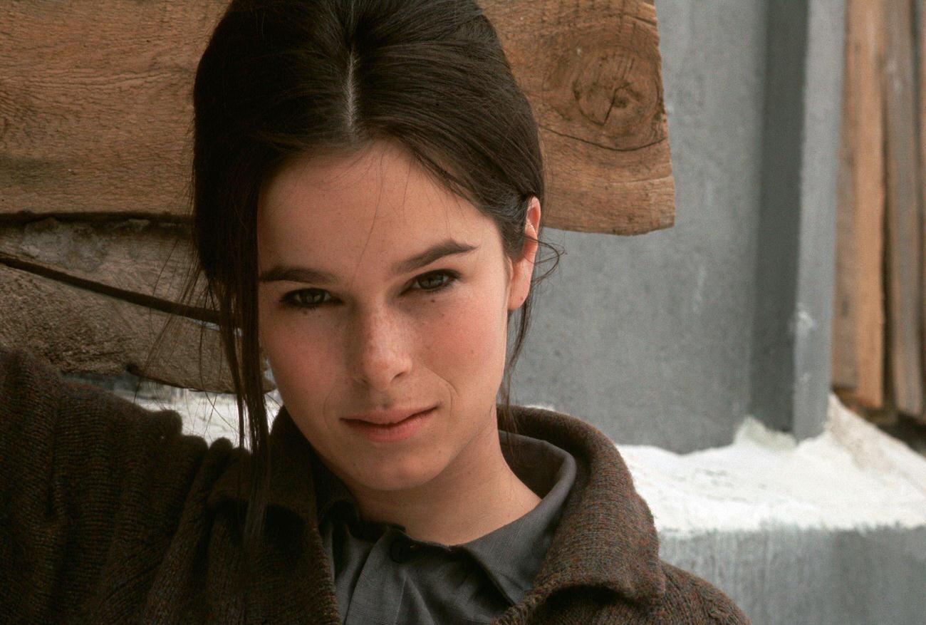 Geraldine Chaplin Standing Against A Wall.