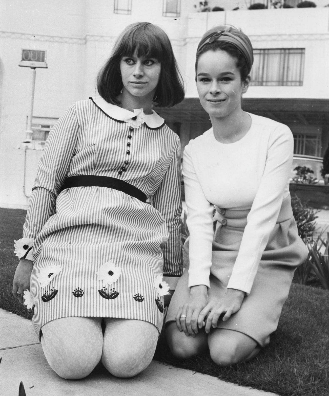 Rita Tushingham And Geraldine Chaplin Kneeling On The Grass At The Dorchester Hotel In London, April 24Th, 1966.