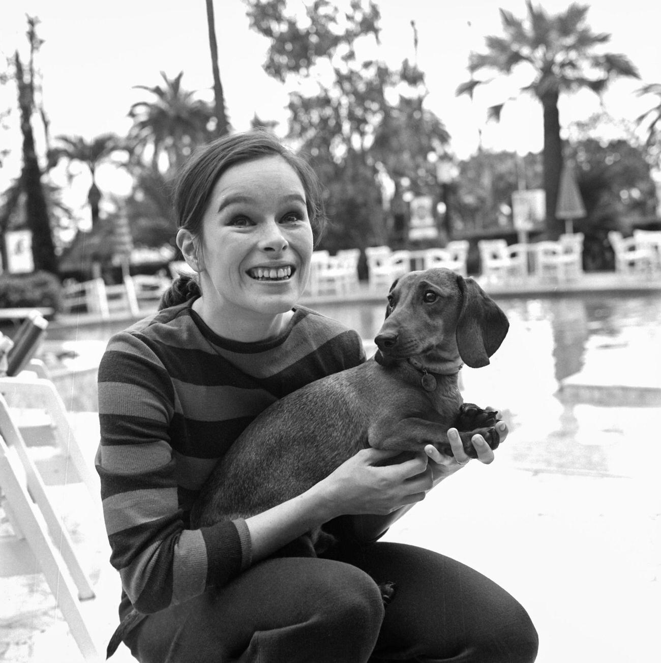 Geraldine Chaplin With Her Dachshund By The Pool In Cannes, France, May 15, 1968.