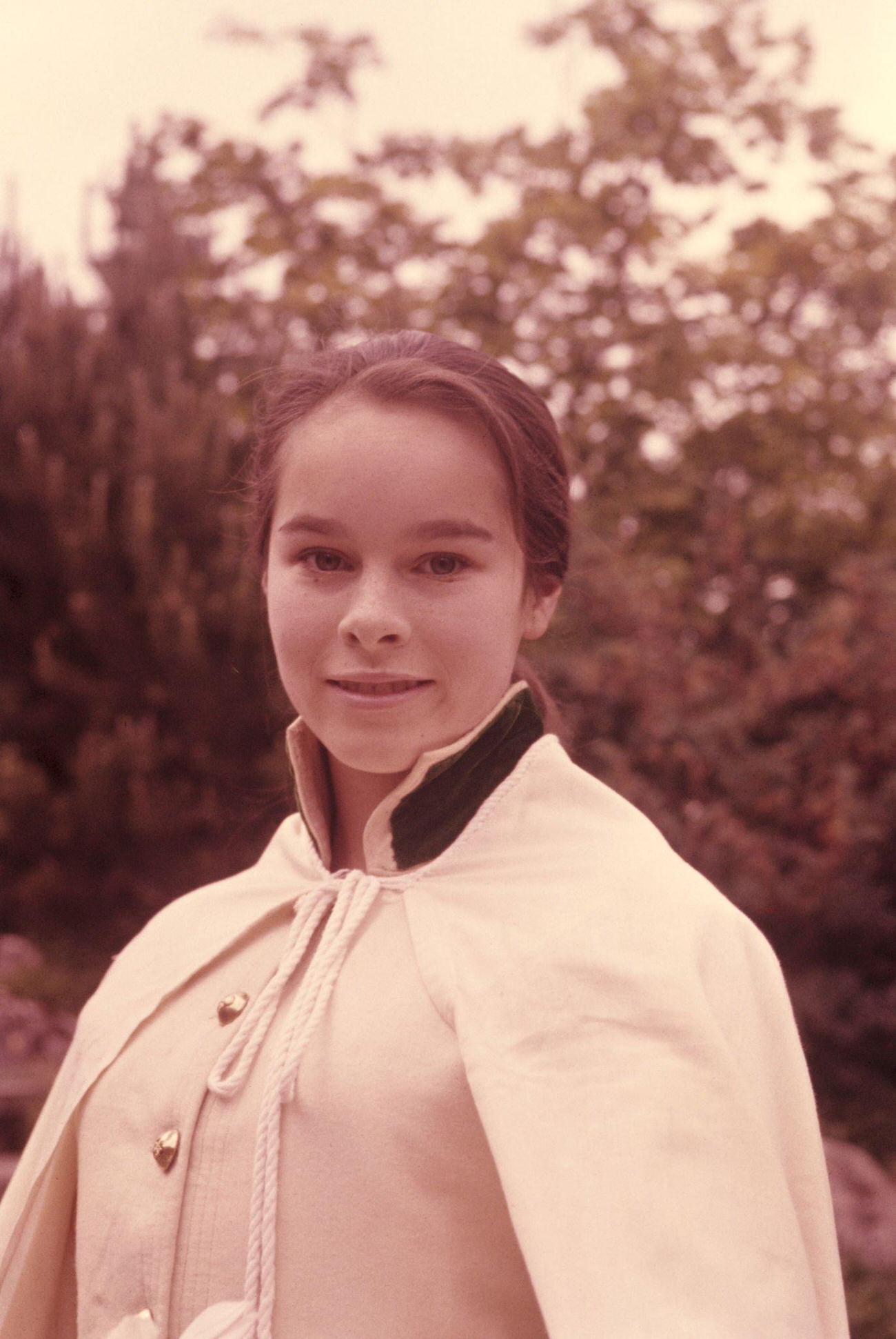Geraldine Chaplin In A Military Parade Costume, Smiling In An Outdoor Portrait, 1970.