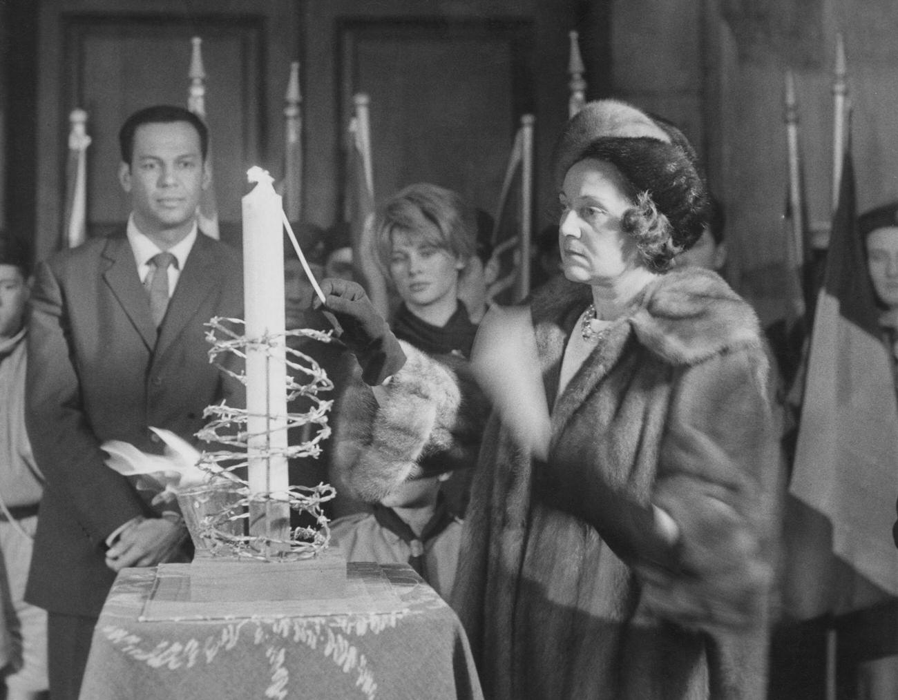 Odette Hallowes Lighting A Candle With Cy Grant And Julie Christie, London, December 10, 1961.