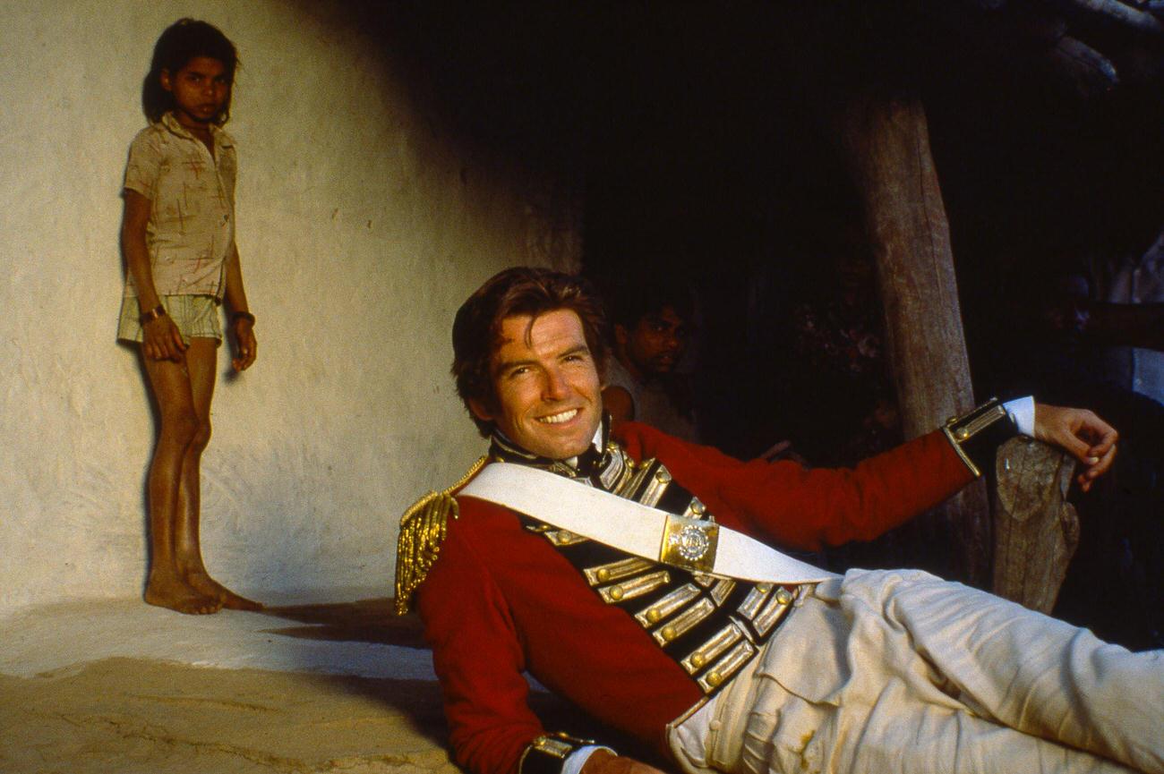 Pierce Brosnan In Costume As 'William Savage' With A Child Actor During Filming Of &Amp;Quot;The Deceivers,&Amp;Quot; Jaipur, India, September 1987.