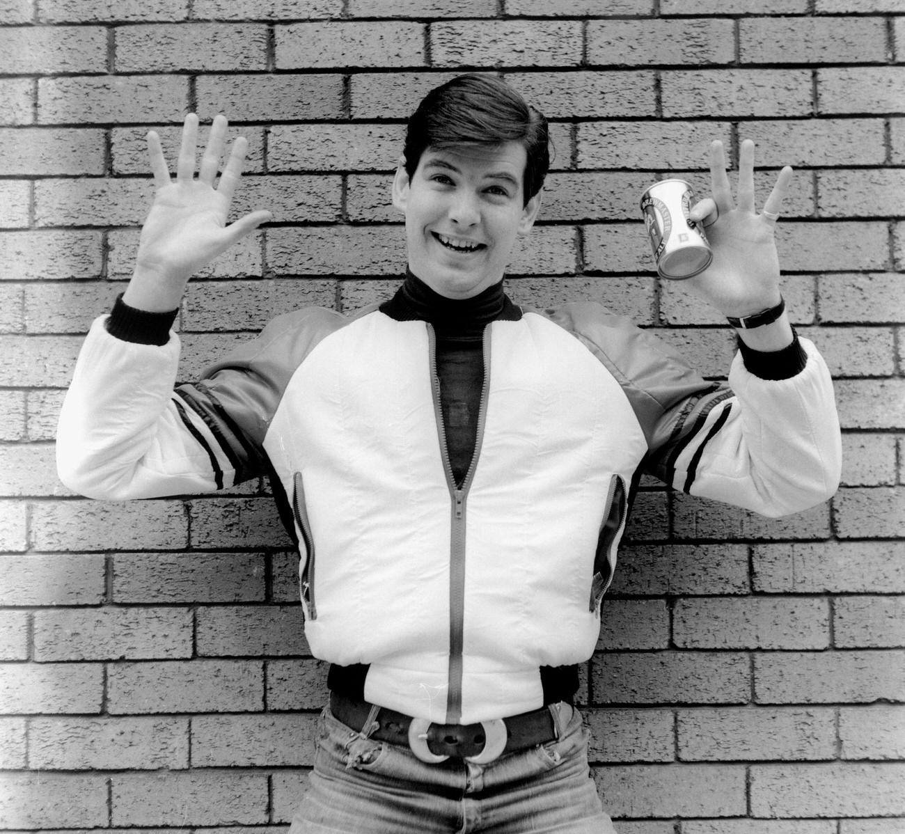 Pierce Brosnan Holding A Can Of Beer, London, Circa 1978.