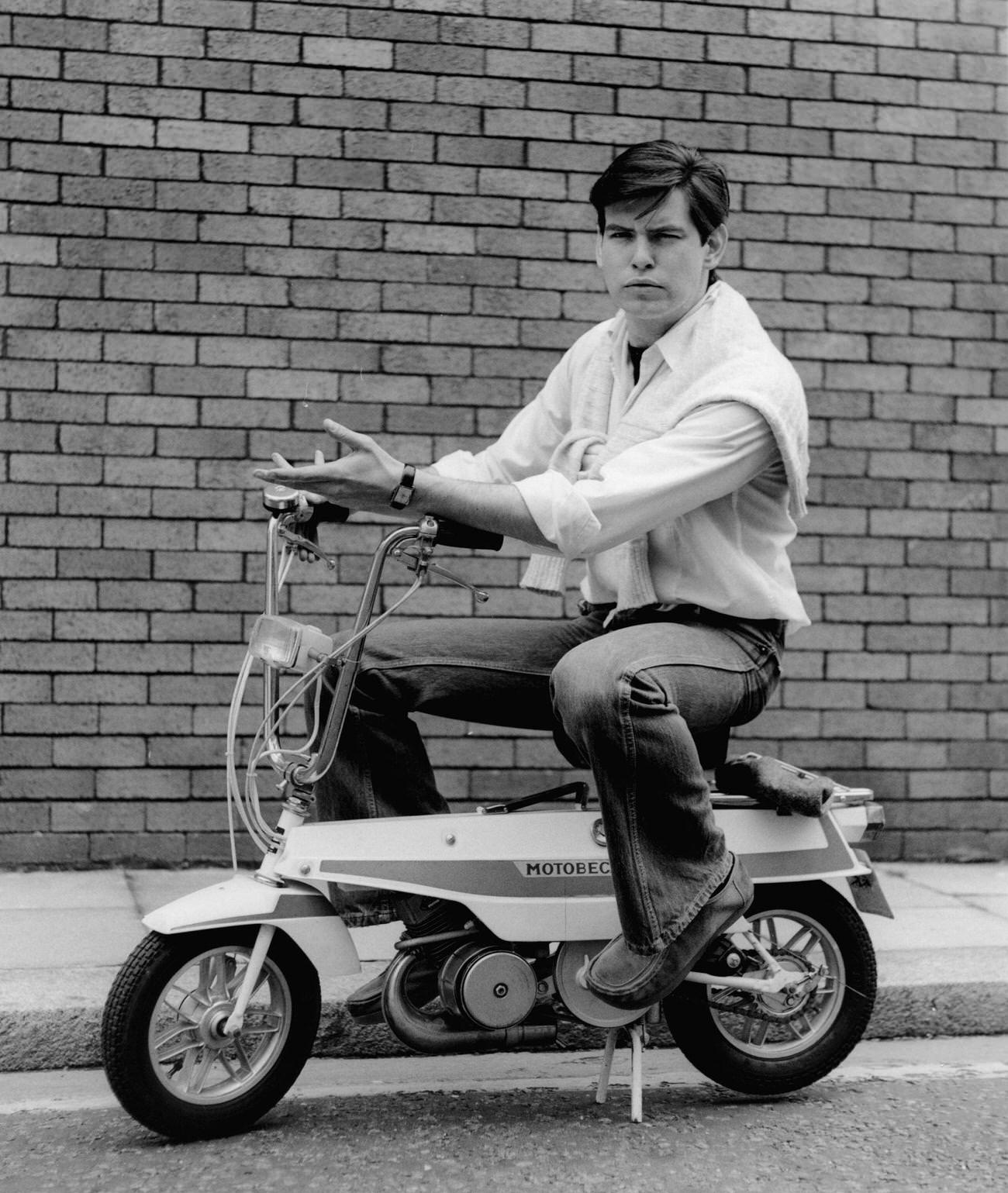 Pierce Brosnan Sitting On A Scooter, London, Circa 1978.