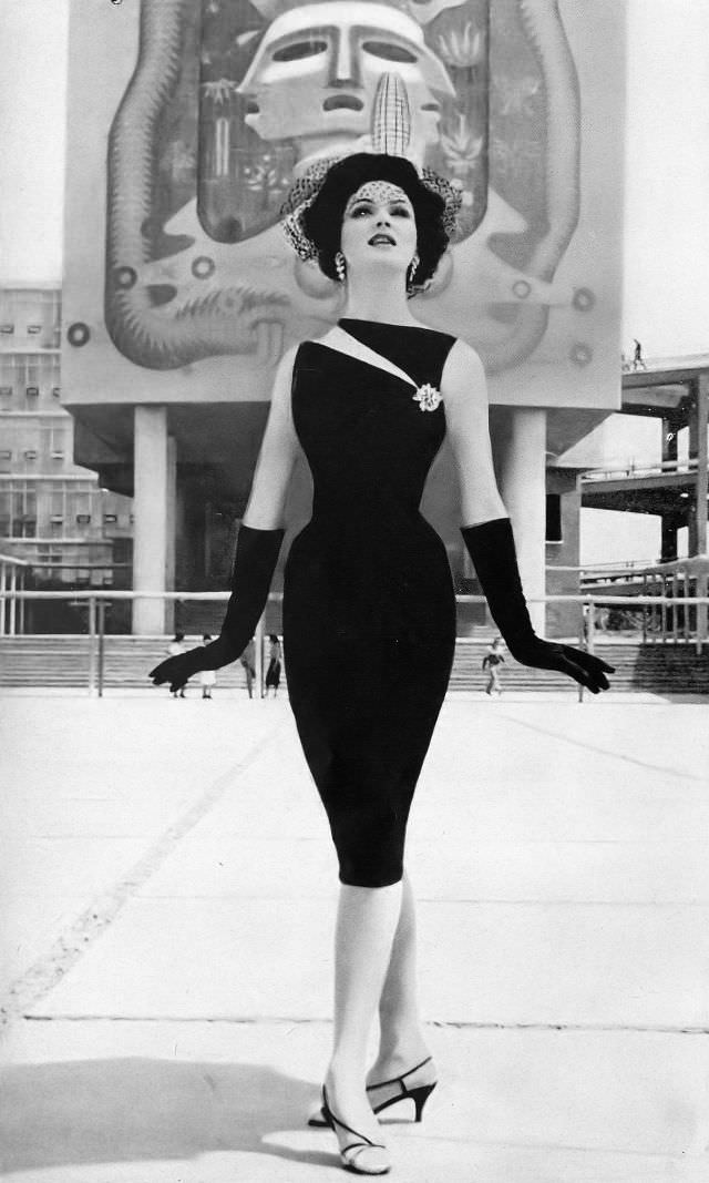 Betsy Pickering In Black Silk Sleeveless Sheath With Side-Slashed Neckline By Luis Estévez, Harper'S Bazaar, May 1960.