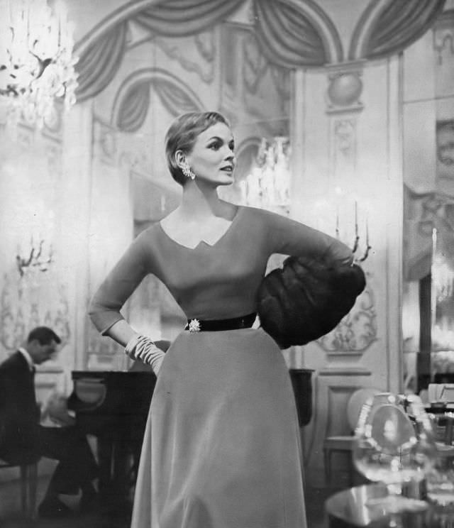 Linda Harper In An Amber Velvet Dress With A Bronze Belt By Eisenberg, 1954.