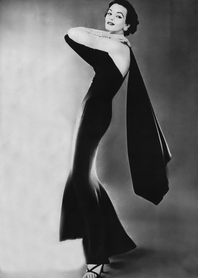 Linda Harper In A Slinky Black Silk Crêpe Evening Dress By Traina-Norell, 1952.