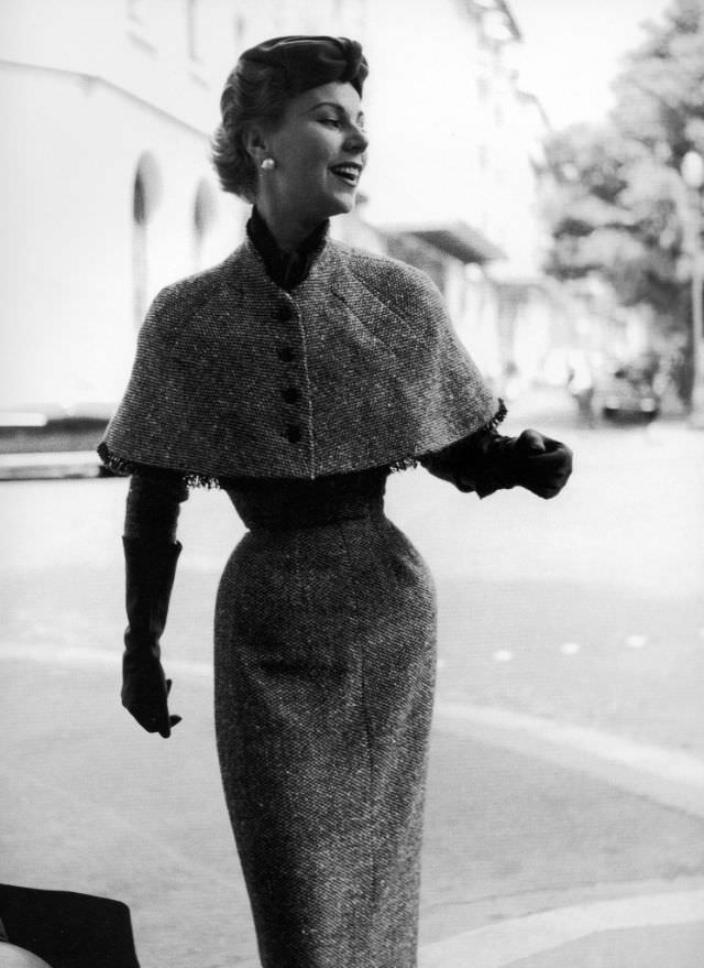 Stella In A Tweed Afternoon Dress With Capelet By Jacques Fath, 1953.