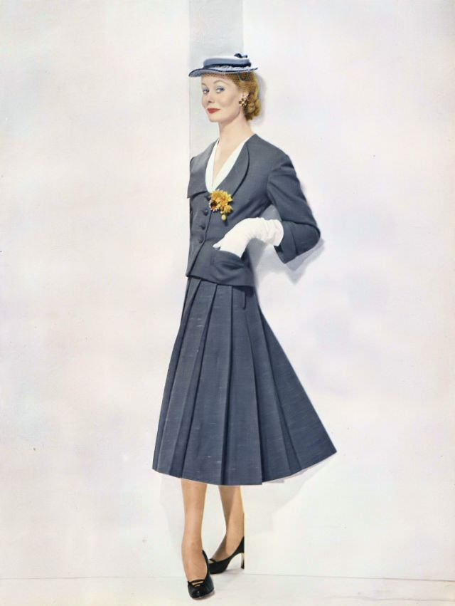 Nina De Voogt In Gray Nubbed Worsted Suit By Ben Zuckerman, Sally Victor Hat, Vogue, January 1, 1952.
