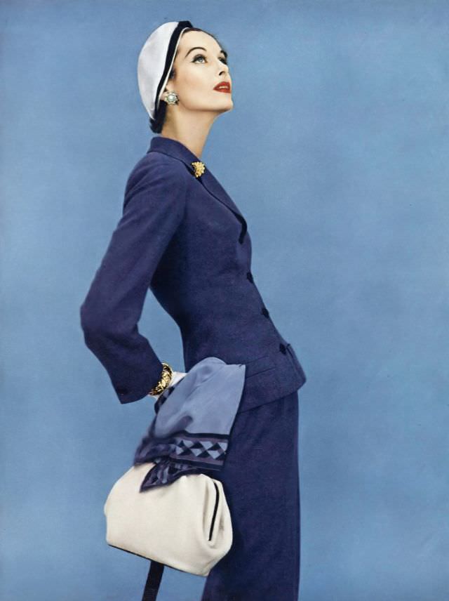 Anne St. Marie In Adele Simpson Wool Suit, Sally Victor Hat, Vogue, January 1, 1955.