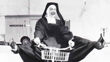 Rosalind Russell Riding Bicycle