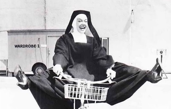 Rosalind Russell Riding Bicycle