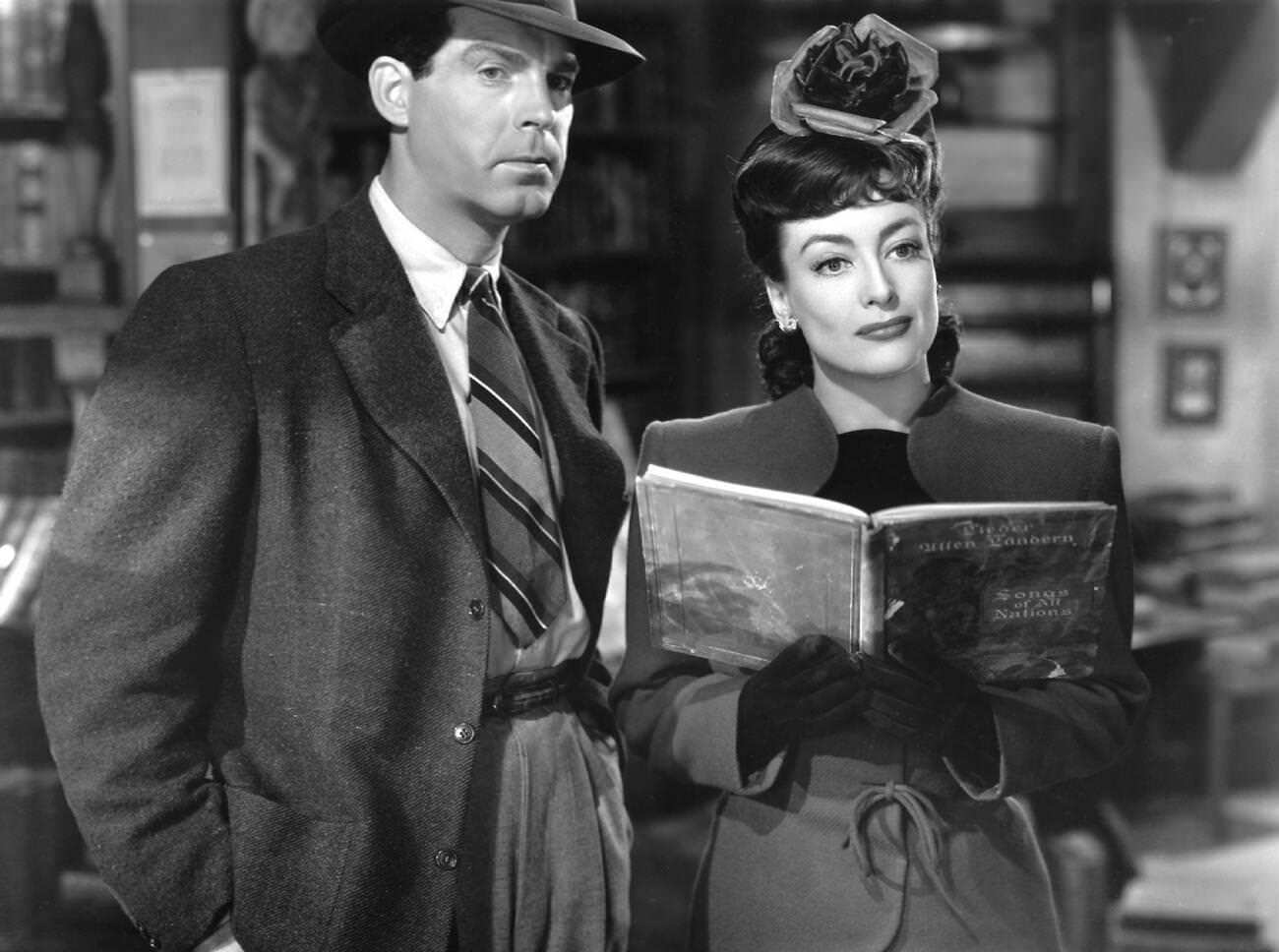 Fred Macmurray And Joan Crawford In The German Title Gefährliche Flitterwochen (Above Suspicion), 1943.