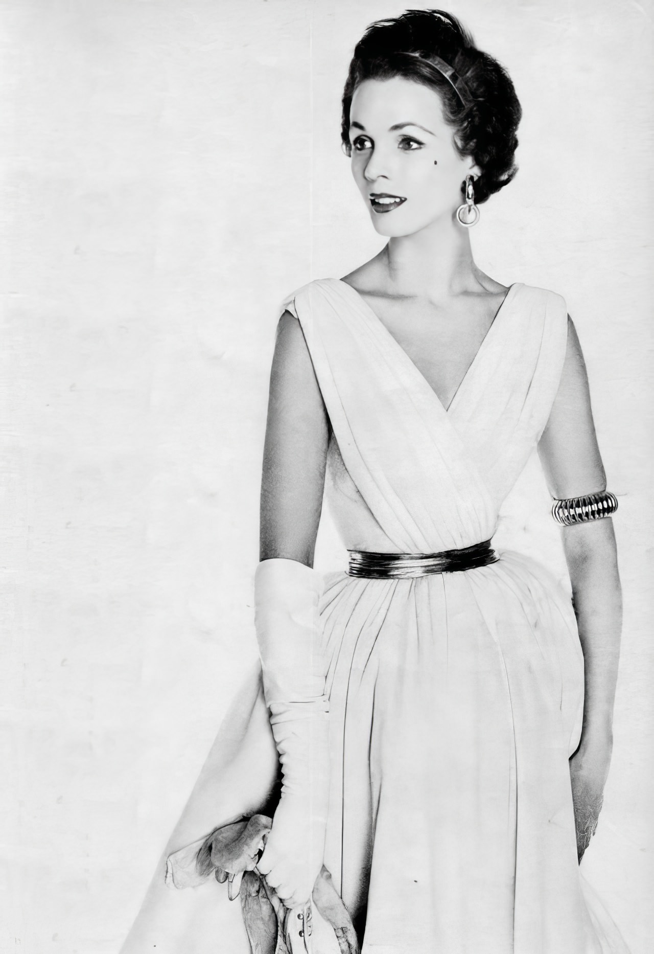A Model In A White Jersey Dress By Anne Fogarty, Vogue, January 1953.