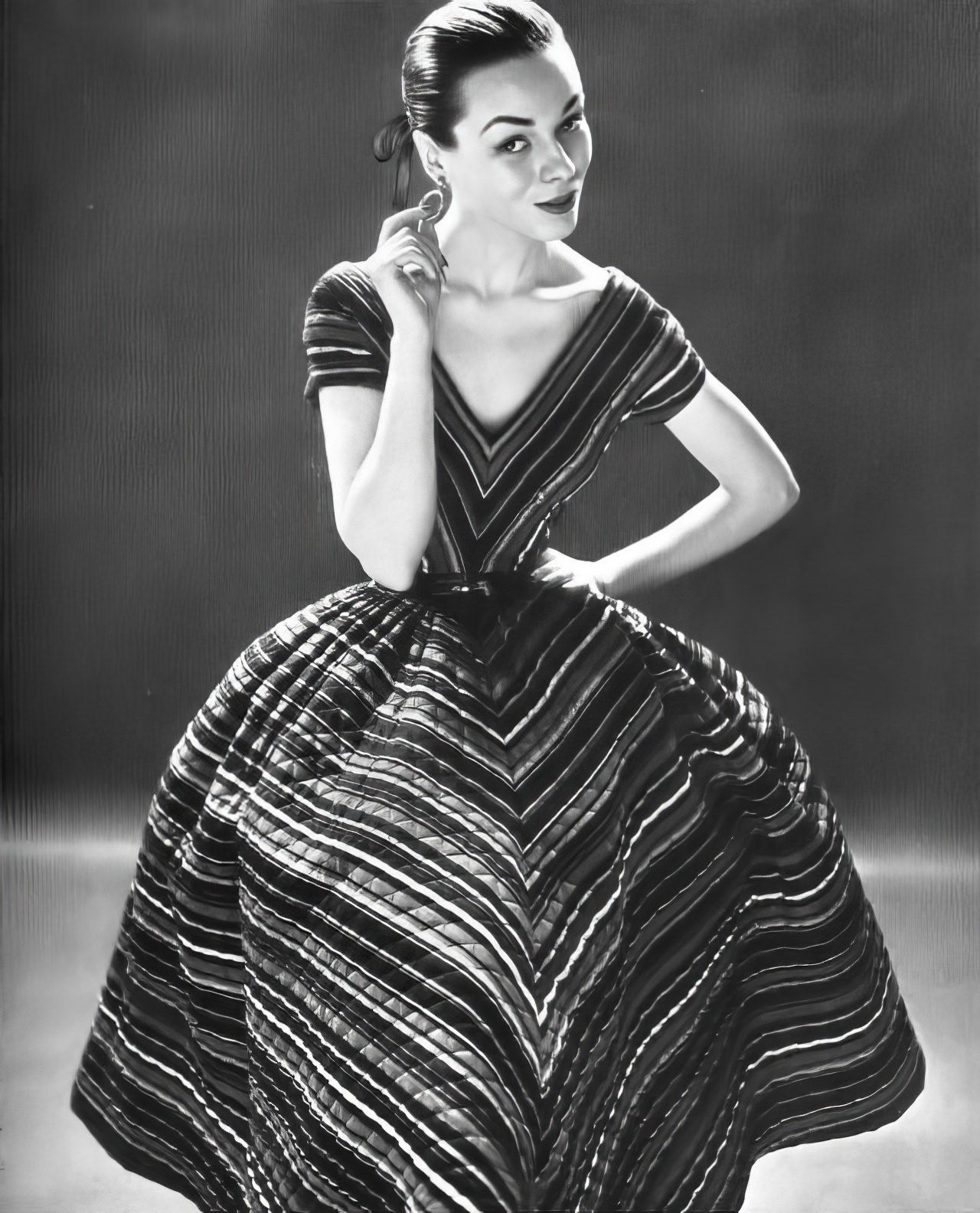Sandy Brown In A Quilted Striped Dress By Anne Fogarty, Vogue, February 1, 1952.