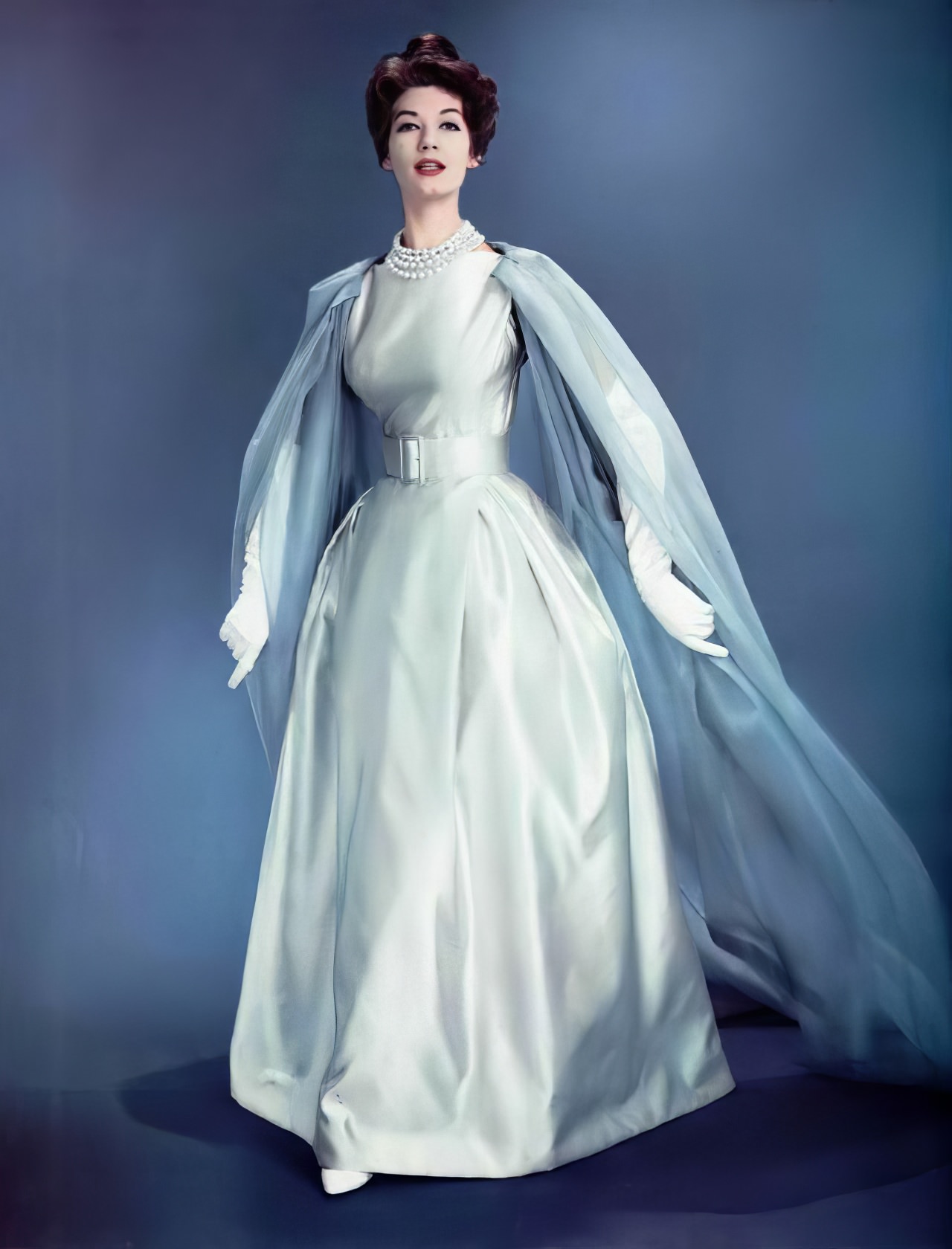 Simone D'Aillencourt In An Ice Blue Satin Evening Gown By Jean Patou, 1957.