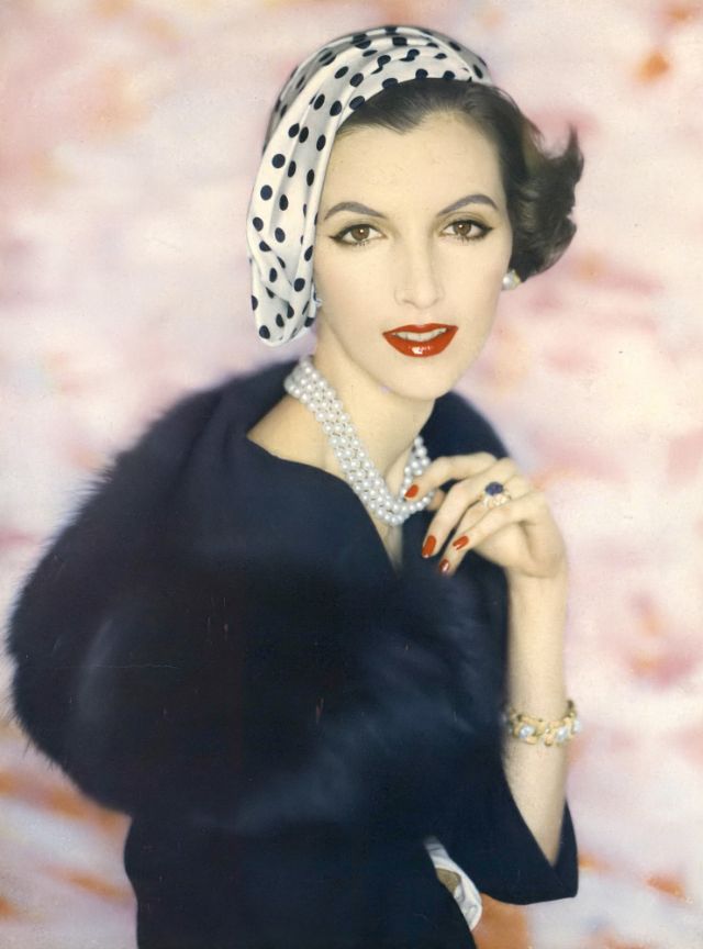 Joan Romano Is Wearing A Side Swirled Silk Surah Hat With Navy Polka-Dots By Sally Victor, Navy Wool Suit With Dyed Navy Fox Collar By George Carmel, Jewelry By David Webb, Photo By Clifford Coffin, February 15, 1957