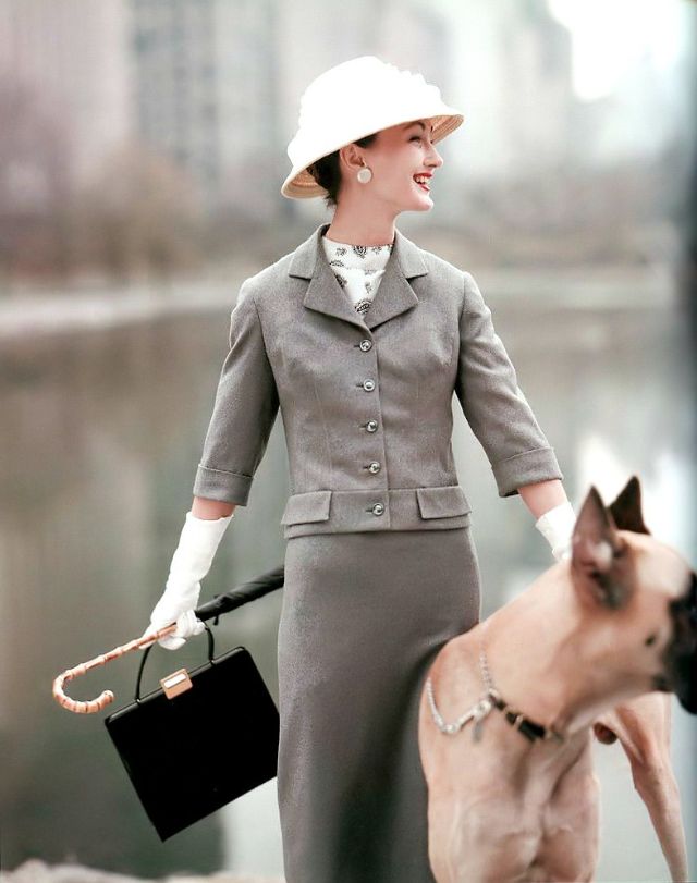 Joan Romano In Easy Suit With Shorter Jacket, Lambskin Gloves, Hat, Scarf, Bag, All At Bonwit Teller, Photo By Karen Radkai, Vogue, February 1956
