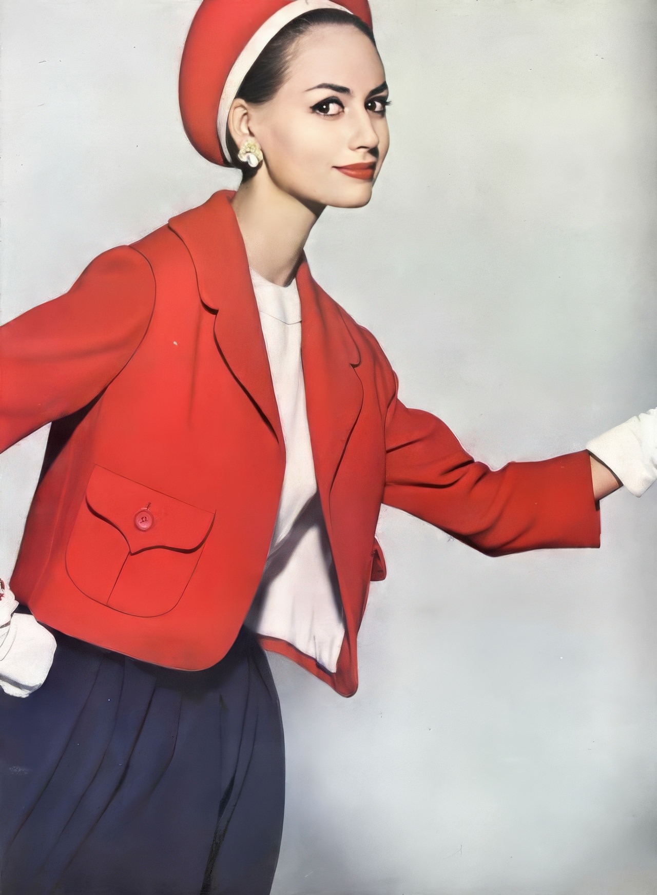 Katherine Pastrie In A Red Wool Crêpe Jacket And Navy Skirt By Maurice Rentner, Vogue, January 15, 1960.