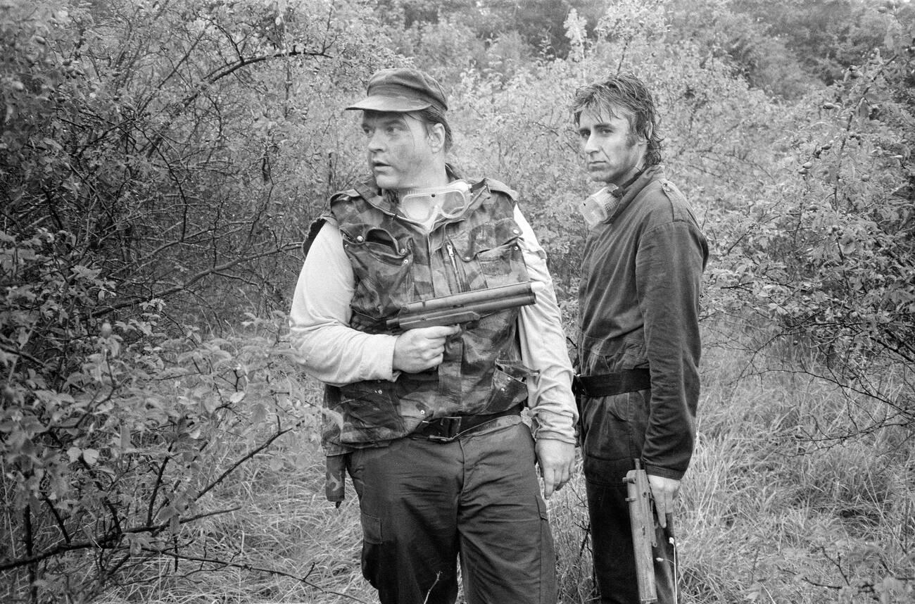 Meat Loaf And John Parr In A Survival Game In Common Wood, Near Hatfield, 1986.