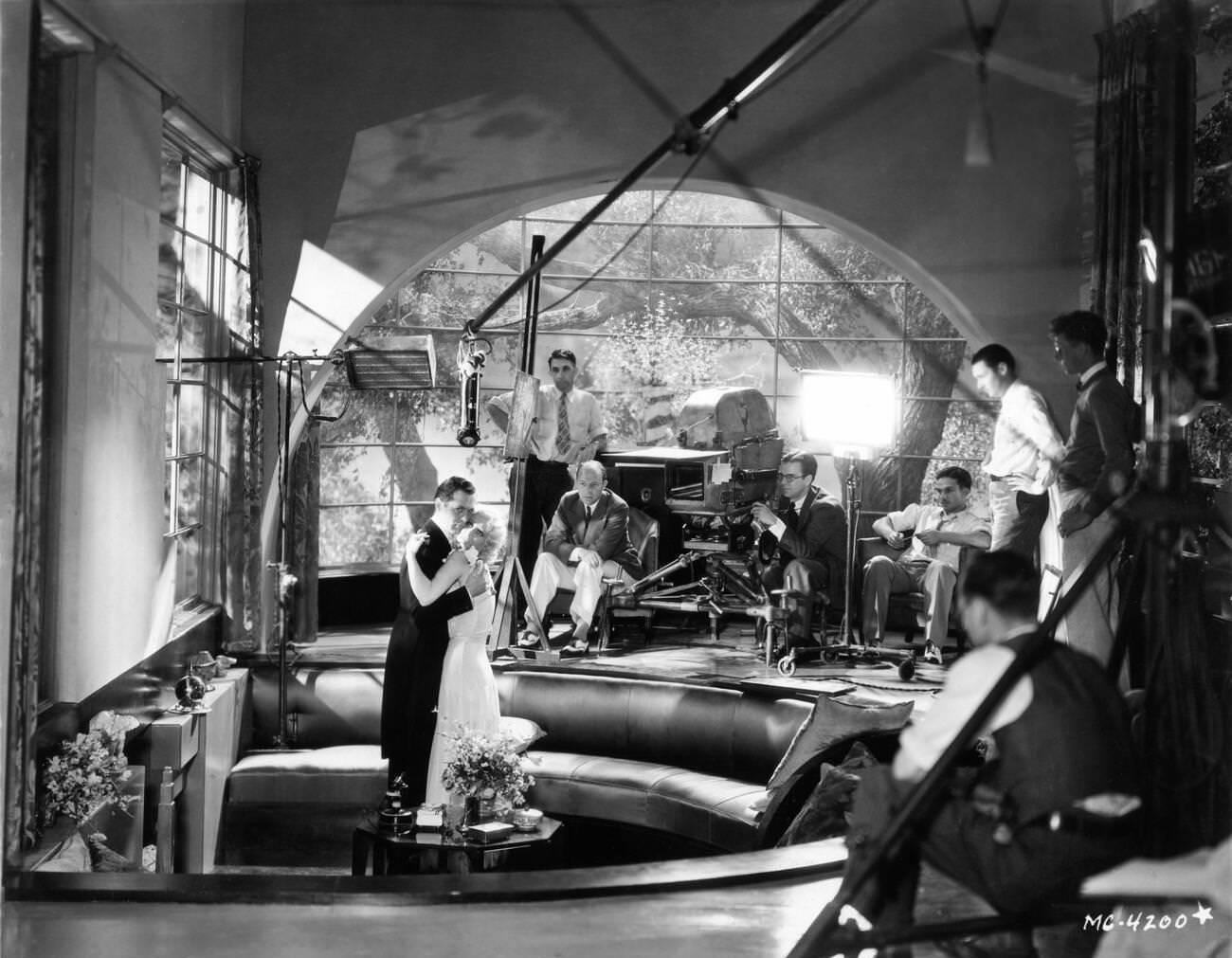 Robert Montgomery And Joan Crawford With Director Harry Beaumont During Filming Of &Amp;Quot;Our Blushing Brides,&Amp;Quot; 1930.