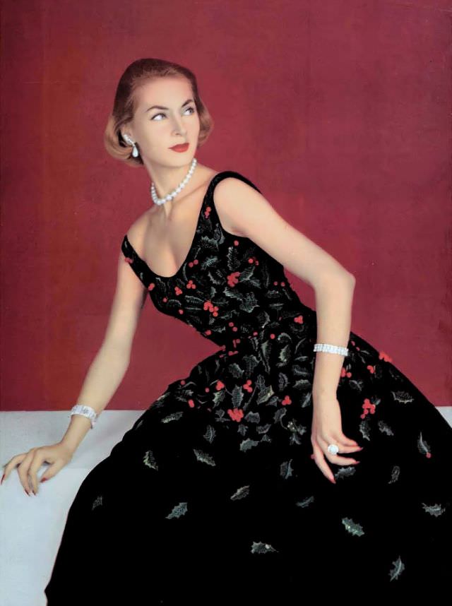 Ghislaine Arsac In The Perfect Holiday Dress, Black Velvet Embroidered With Sprigs Of Green Holly And Red Berries By Pierre Balmain, 1955.