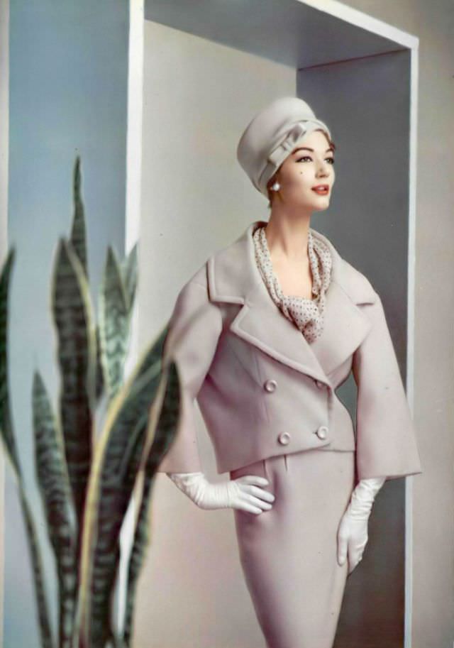 Simone D'Aillencourt In A Lilac Wool Suit, The Collar And Lapels Are Widened And The Jacket Tilts Slightly To The Back, By Pierre Balmain, 1957.