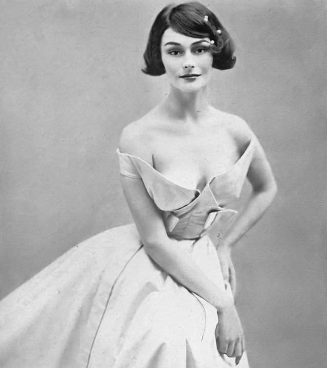 Anne Gunning In Pale Blue Satin, Folded Stiffly Into Low Curves That Slides Into Band Sleeves By Jacques Heim, Photo By Richard Avedon, Harper'S Bazaar, October 1954