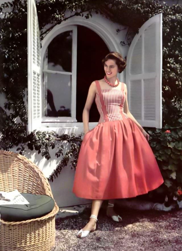 Model In Charming Summer Dress, Red Suspenders Tie In The Striped Bodice To The Full Skirt By Jacques Heim, Photo By Philippe Pottier, 1955