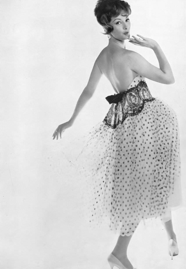 Model In Lovely Dress Of Spotted Net Topped With Black Lace And Held At The Back In Black Velvet Bow, By Jacques Heim, Photo By Richard Dormer, Harper'S Bazaar Uk, April 1958