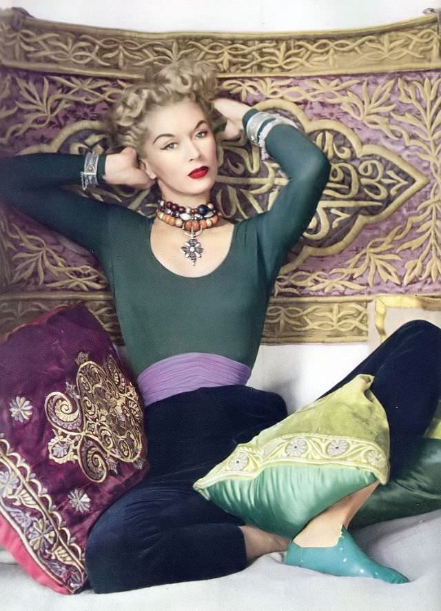 Lisa Fonssagrives-Penn Is Wearing Green Jersey Top Tucked Into Slim Velvet Pants Cinched By Purple Fascia Belt All By Jacques Heim, Photo By Husband Irving Penn, Vogue, April 1952