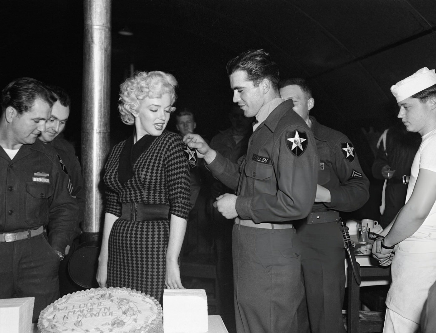 Pfc. Ken Allen Pinning A 2Nd Division Patch On Monroe, 1954.
