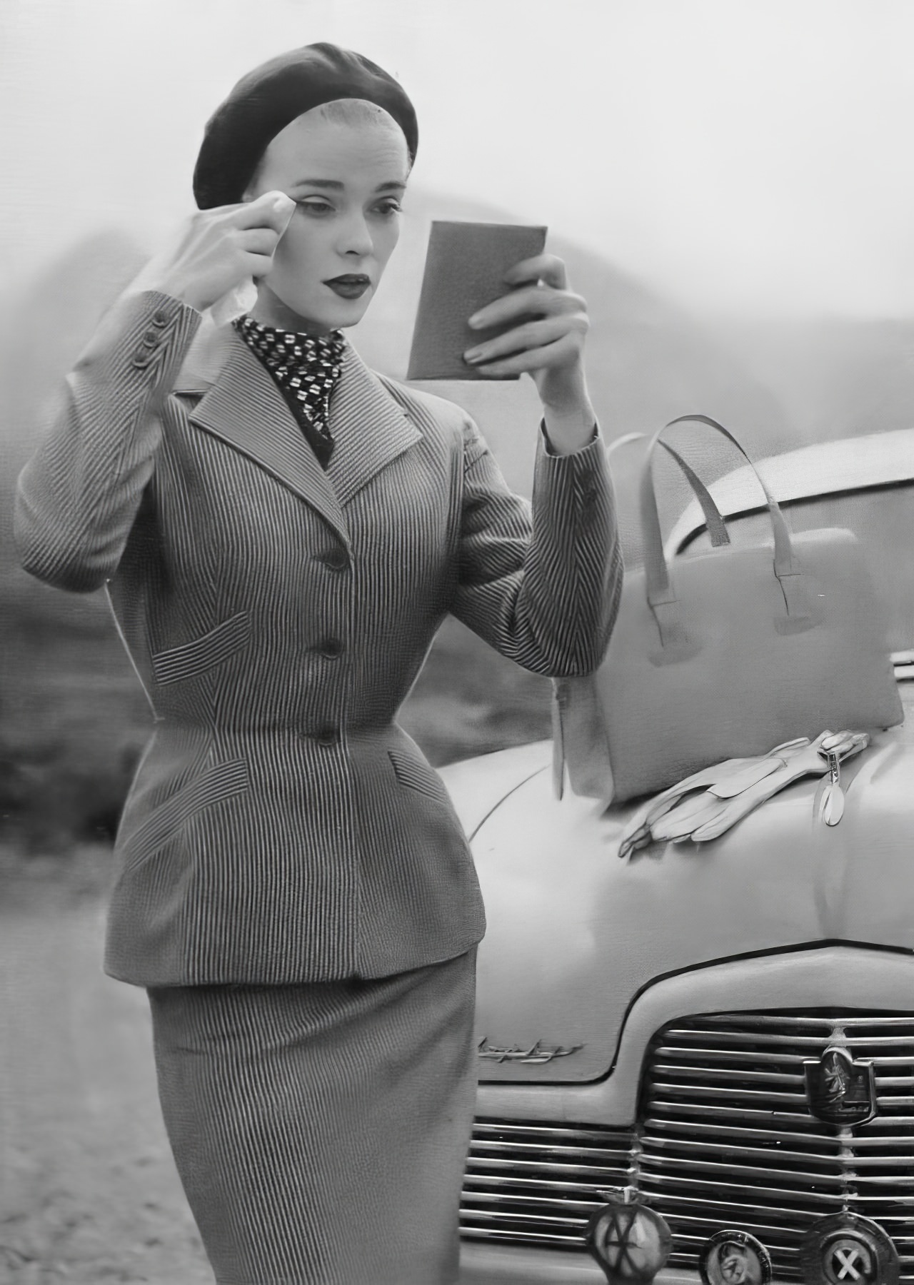 Susan Abraham In A Gray Wool Suit Faintly Striped With Pink, 1953.