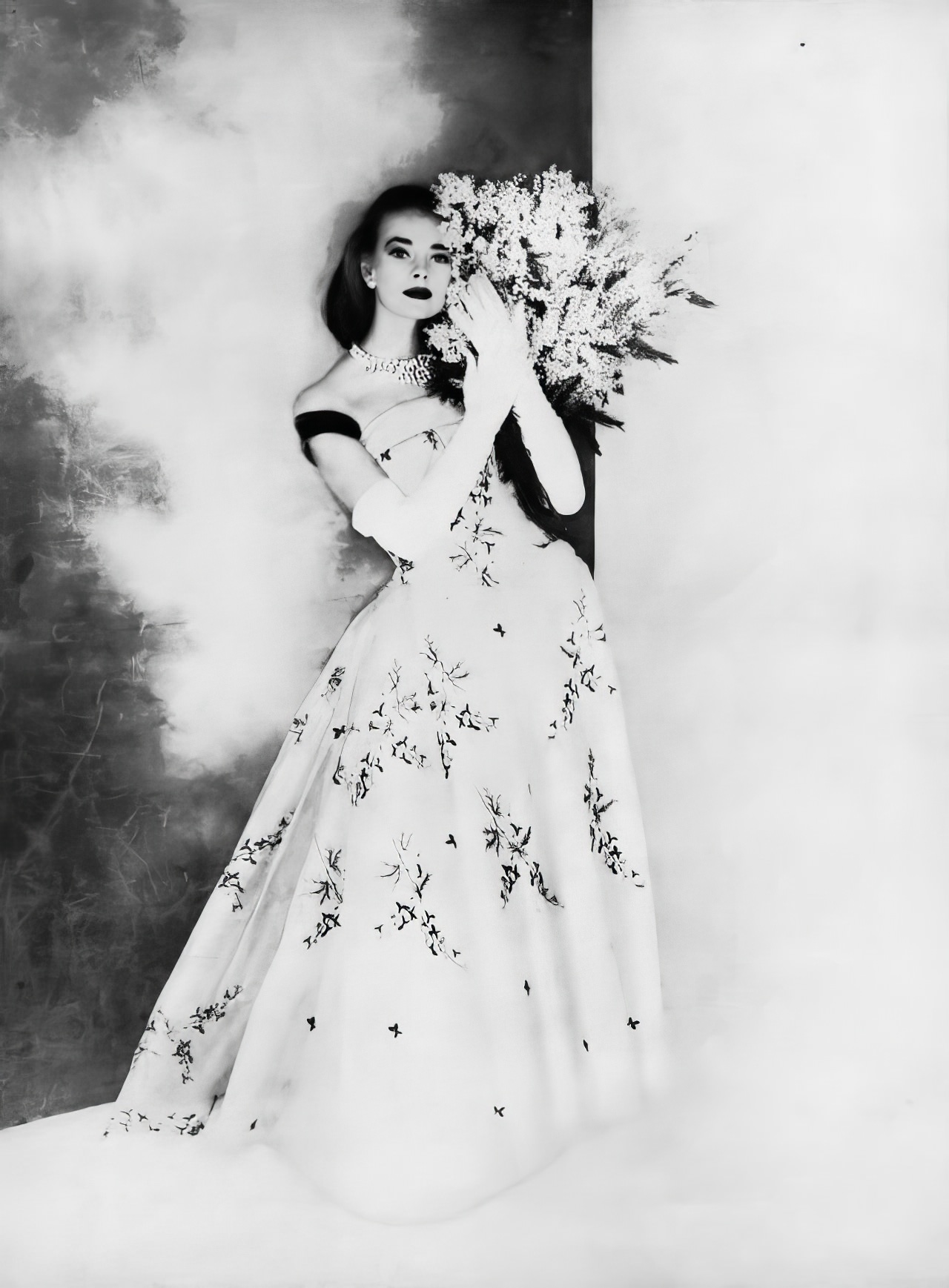 Susan Abraham In A Beautiful Ball Gown Of Bluebells Embroidered On White Silk Organdie, 1956.