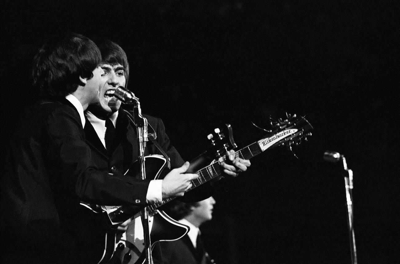 More Than Six Months After Taking The East Coast By Storm, The Fab Four Traveled To California To Take The Stage At The Cow Palace In San Francisco For Opening Night Of Their First-Ever Concert Tour Of North America. Paul Mccartney (Left) And George Harrison Belting Out One Of Their Many Hits On Stage. , 1964.