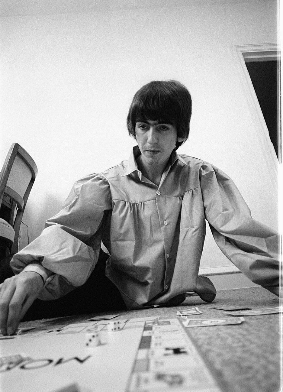 George Harrison Playing Monopoly At The Beatles Bel Air Home In California During The Tour, 1964.