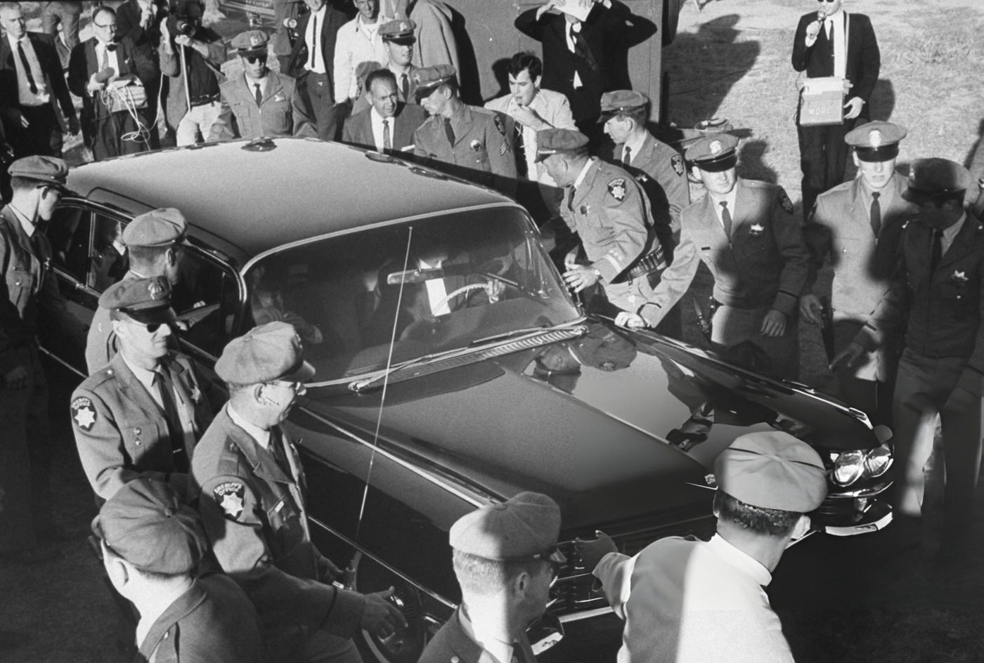 Police And Fans Surrounding Car The Beatles Are Traveling In From The Airport.