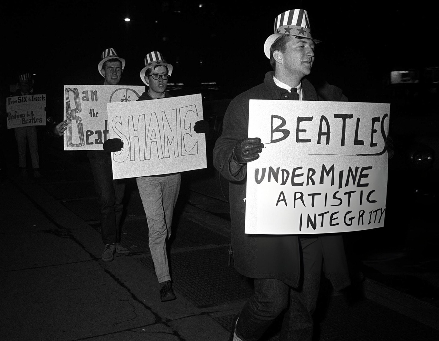 Americans Holding Placards Protest Against The Beatles In New York During The Band'S Tour Of America.