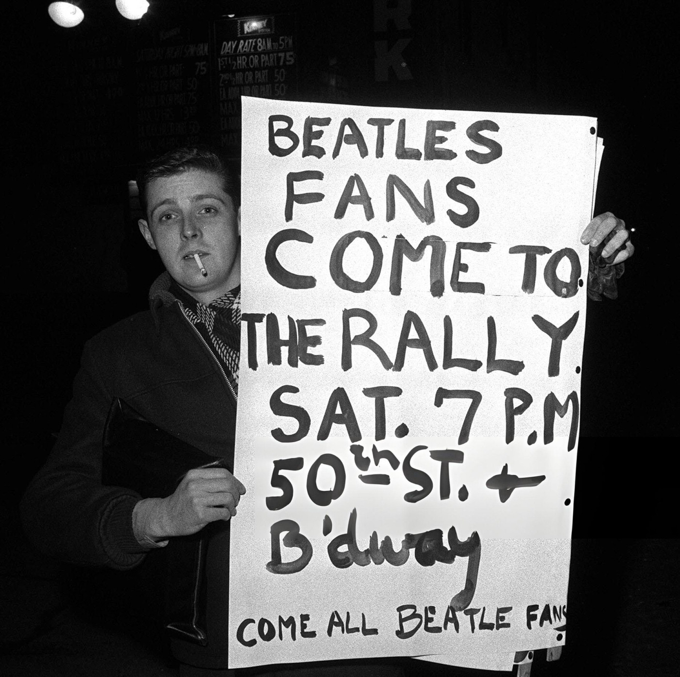 An American Fan Of The British Pop Group The Beatles Holding A Placard To Urge Fans To Attend A Rally During The Band'S Tour Of America.