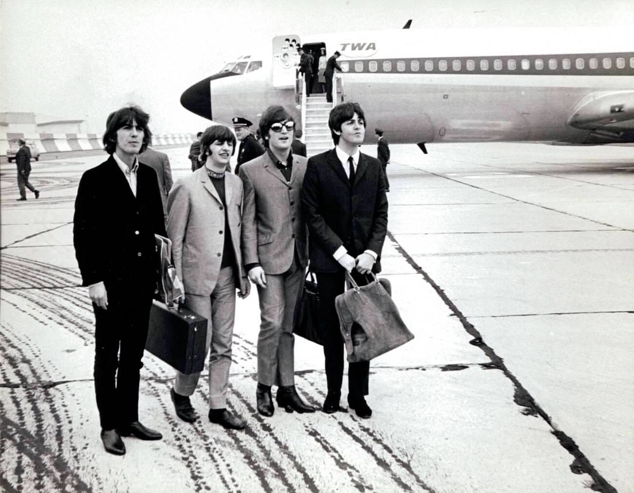 The Beatles, John Lennon, George Harrison, Ringo Starr, And Paul Mccartney Arrive At New York'S Kennedy Airport On A Snowy Day, 1964.