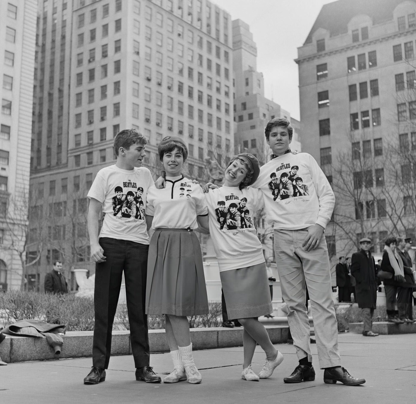 Four Beatles Fans Standing Together Wearing Beatles T-Shirts And Sweat Shirts Outside The Plaza Hotel In New York, 1964.